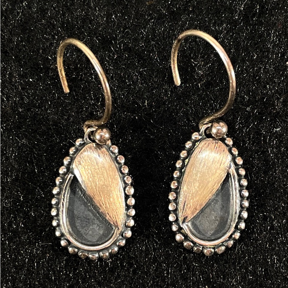 Sterling silver “winking earrings” by designer Anni Maliki.  EUC.